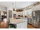 Well-equipped kitchen featuring a large island with seating, stainless steel appliances, and abundant storage at 3726 Orion Ln, Mount Pleasant, SC 29466