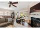 Inviting living room featuring a cozy fireplace, large windows, and stylish furnishings, perfect for relaxation at 3726 Orion Ln, Mount Pleasant, SC 29466