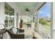 Charming screened porch with seating area and a view of the backyard at 3726 Orion Ln, Mount Pleasant, SC 29466