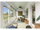 Charming screened porch with wicker furniture, offering a relaxing outdoor space with scenic views at 3726 Orion Ln, Mount Pleasant, SC 29466