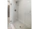 Modern walk-in shower with white subway tile, glass door, and tiled base, complemented by contemporary fixtures at 3726 Orion Ln, Mount Pleasant, SC 29466