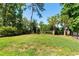 A backyard featuring green grass and surrounding privacy bushes with a black fence at 3741 Juneberry Ct, Mount Pleasant, SC 29466