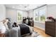 Bright bedroom with hardwood floors, ceiling fan, and plantation shutters for natural light at 3741 Juneberry Ct, Mount Pleasant, SC 29466