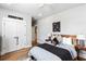 Bright bedroom with hardwood floors, ceiling fan, and a view to the hallway at 3741 Juneberry Ct, Mount Pleasant, SC 29466