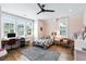 Bright, airy bedroom featuring large windows, a ceiling fan, and hardwood floors at 3741 Juneberry Ct, Mount Pleasant, SC 29466