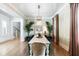 Formal dining room featuring vibrant wallpaper and hardwood floors with a table and seating for eight at 3741 Juneberry Ct, Mount Pleasant, SC 29466