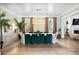 Elegant dining room with wallpaper, hardwood floors, and large table with green chairs at 3741 Juneberry Ct, Mount Pleasant, SC 29466