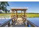 Waterfront property featuring a private dock with access to serene waters and marsh views at 3741 Juneberry Ct, Mount Pleasant, SC 29466