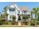 Beautiful two-story home with white siding, a covered front porch, and well manicured landscaping at 3741 Juneberry Ct, Mount Pleasant, SC 29466