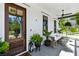 Inviting front porch featuring a swing, ceiling fan, and stylish decor at 3741 Juneberry Ct, Mount Pleasant, SC 29466
