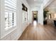 Welcoming hallway with hardwood floors and natural light, accented by neutral colors and refined details at 3741 Juneberry Ct, Mount Pleasant, SC 29466