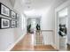 Bright hallway with hardwood floors leading to a bedroom, lots of natural light at 3741 Juneberry Ct, Mount Pleasant, SC 29466