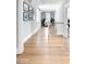 Bright hallway with hardwood floors, lots of natural light and a gallery of pictures at 3741 Juneberry Ct, Mount Pleasant, SC 29466