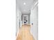 Bright hallway with hardwood floors and neutral paint provides access to bedrooms and bathrooms at 3741 Juneberry Ct, Mount Pleasant, SC 29466