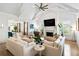 Inviting living room features a cozy fireplace, a large TV, and comfortable seating for relaxation and entertainment at 3741 Juneberry Ct, Mount Pleasant, SC 29466