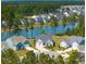 An aerial view of a beautiful home on the water surrounded by lush greenery at 393 Tupelo Lake Dr, Summerville, SC 29486