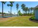 Expansive backyard with a peaceful view of the lake, mature trees, and manicured lawn, creating a private retreat at 393 Tupelo Lake Dr, Summerville, SC 29486