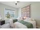 Bright bedroom with two twin beds, a window view, and cozy decor at 393 Tupelo Lake Dr, Summerville, SC 29486