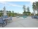 Relaxing community pool area with ample seating and shaded umbrellas for comfortable lounging at 393 Tupelo Lake Dr, Summerville, SC 29486