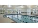Bright indoor pool area featuring large windows and clear water for year-round enjoyment at 393 Tupelo Lake Dr, Summerville, SC 29486