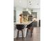 Modern kitchen with a large island, pendant lighting, and stainless steel appliances at 393 Tupelo Lake Dr, Summerville, SC 29486