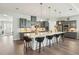 Modern kitchen with a large island, pendant lighting, and stainless steel appliances at 393 Tupelo Lake Dr, Summerville, SC 29486