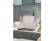 Close-up of kitchen with gray cabinets, gas range, and tiled backsplash, showcasing the modern design at 393 Tupelo Lake Dr, Summerville, SC 29486