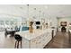 Open-concept kitchen with large island, pendant lighting, and stainless steel appliances at 393 Tupelo Lake Dr, Summerville, SC 29486