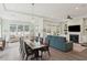 Bright open-concept living room, dining area, and view to a fireplace at 393 Tupelo Lake Dr, Summerville, SC 29486