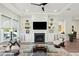 Bright living room featuring a fireplace, custom built-ins, and elegant decor at 393 Tupelo Lake Dr, Summerville, SC 29486