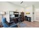 Well-equipped home office with a workstation, comfortable seating, and natural light, creating an ideal workspace at 393 Tupelo Lake Dr, Summerville, SC 29486
