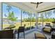 Screened patio featuring views of the lake, with seating and dining areas for relaxation and entertainment at 393 Tupelo Lake Dr, Summerville, SC 29486