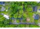 Aerial view of a house with a lush tree canopy offering privacy and a neighborhood layout at 411 Berkeley Dr, Moncks Corner, SC 29461