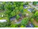 An aerial view of the neighborhood showcasing the lush green canopy, community layout, and property's location at 411 Berkeley Dr, Moncks Corner, SC 29461
