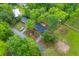 An aerial view of the home showcasing the mature trees, backyard, driveway, and neighboring properties at 411 Berkeley Dr, Moncks Corner, SC 29461
