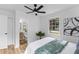 Cozy bedroom with a ceiling fan, soft lighting, and an ensuite bathroom at 411 Berkeley Dr, Moncks Corner, SC 29461