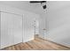 Bedroom with hardwood floors, closet, and white door at 411 Berkeley Dr, Moncks Corner, SC 29461