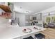 Stylish kitchen with grey cabinets, stainless appliances, and an open layout to the living room at 411 Berkeley Dr, Moncks Corner, SC 29461