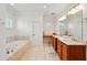 Bathroom with a built-in tub, double vanity, and ample counter space for enhanced usability at 416 Barbadian Way, Mount Pleasant, SC 29464