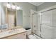 Bathroom showcasing a single sink, shower with glass door, and an inviting aesthetic at 416 Barbadian Way, Mount Pleasant, SC 29464
