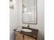 The Powder room has white shiplap walls, a mirror and an ornate vessel sink at 416 Barbadian Way, Mount Pleasant, SC 29464