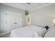 This is a bedroom with white walls, a ceiling fan and a door leading to a patio at 416 Barbadian Way, Mount Pleasant, SC 29464