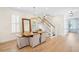 Elegant dining room with a chandelier, wooden table, and staircase views at 416 Barbadian Way, Mount Pleasant, SC 29464