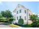 Two story home with lush shrubbery, a welcoming porch, and a shade tree at 416 Barbadian Way, Mount Pleasant, SC 29464