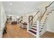 Open-concept living space with a staircase, dining area, and modern kitchen at 416 Barbadian Way, Mount Pleasant, SC 29464