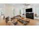 Comfortable living room featuring a fireplace, built-in bench, and hardwood floors at 416 Barbadian Way, Mount Pleasant, SC 29464