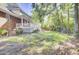Spacious backyard featuring a large deck, swing set, and mature trees providing shade at 4217 Meadowbrook Ct, North Charleston, SC 29420