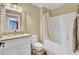 A functional bathroom with a tub/shower combo, tile flooring, and single sink vanity at 4217 Meadowbrook Ct, North Charleston, SC 29420