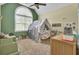 This bedroom has a vaulted ceiling, a window and a play tent at 4217 Meadowbrook Ct, North Charleston, SC 29420