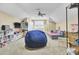 An upstairs bonus room featuring carpet, a ceiling fan, shelving, a couch, and a beanbag chair at 4217 Meadowbrook Ct, North Charleston, SC 29420
